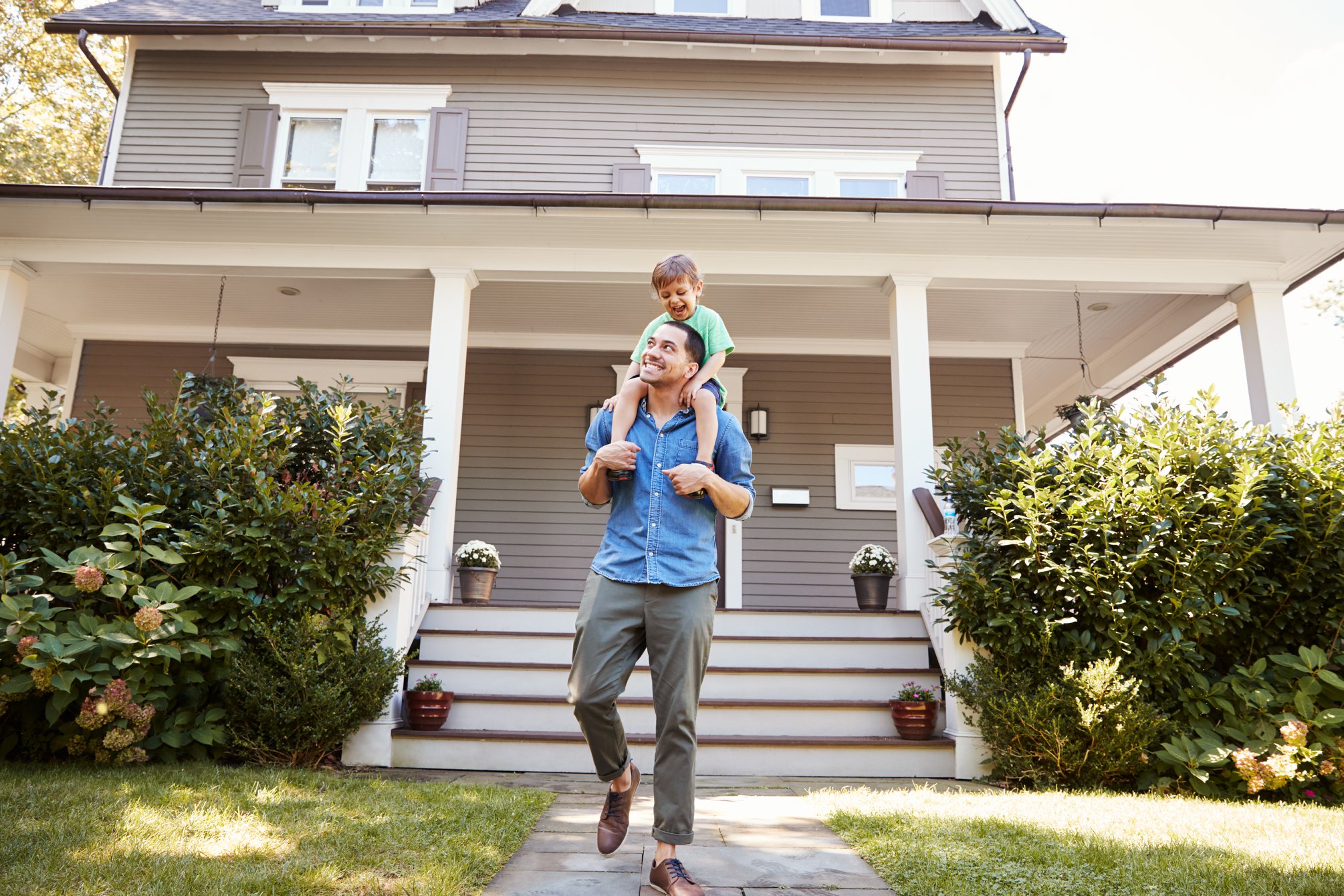 Family enjoying outside their home without worry of bugs